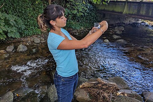 Cllr Leena checks water sample